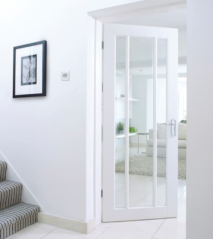 Primed Worcester door with glazed panels, ready for your choice of paint.
